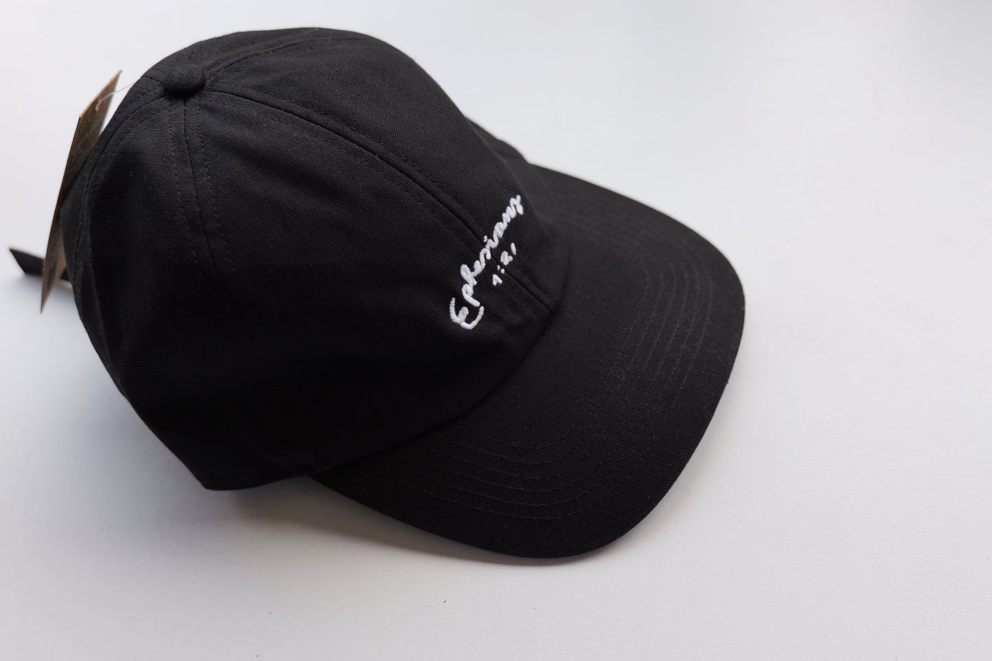 Black hat with a logo on a white background