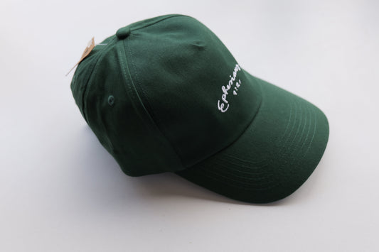 Green cap with white embroidery on a white background